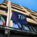 The TIM logo on a flag above an entrance to the Telecom Italia SpA headquarters building in Rome, Italy, on Monday, May 17, 2021. Telecom Italia report results on Wednesday.