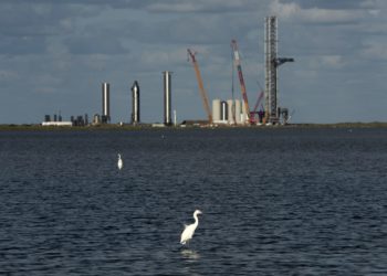 The Space Exploration Technologies Corp. (SpaceX) Starbase launch facility under construction in Boca Chica, Texas, U.S., on Sunday, Oct. 17, 2021. From a sprawling factory outside Austin to a property-buying binge on the Gulf Coast, Elon Musk is making an imprint in a state that has long welcomed eccentric outsiders.