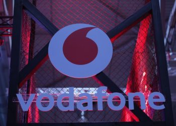 A Vodafone Group Plc logo sits on the company's 5G wireless exhibition stand at the Gamescom computer games industry event in Cologne, Germany, on Tuesday, Aug. 20, 2019. Gamescom is the world's largest gaming convention and runs from August 20 to 24. Photographer: Krisztian Bocsi/Bloomberg