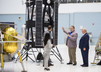 VP of Research and Development of Intuitive Machines, Tim Crain, second from right, speaks with NASA Associate Administrator, Science Mission Directorate, Thomas Zurbuchen, second from left, about their lunar lander, Friday, May 31, 2019, at Goddard Space Flight Center in Md. Astrobotic, Intuitive Machines, and Orbit Beyond have been selected to provide the first lunar landers for the Artemis program's lunar surface exploration. Photo credit: (NASA/Aubrey Gemignani)