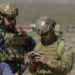 A civilian contractor and a joint terminal attack controller use the Hand Held Link 16, which enables digitally aided close air support integration during the operational assessment of the Hand Held Link 16 radio March 24, 2016, at the Nevada Test and Training Range. Link 16 was originally designed for air-to-air missions, but the technology has made the transition to ground forces providing JTACs advantages on the battlefield that they didn’t previously have. (U.S. Air Force photo by Airman 1st Class Nathan Byrnes)