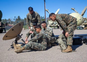 U.S. Marines with 9th Communication Battalion, I Marine Expeditionary Force Information Group, troubleshoot the Marine Corps Wideband Satellite Communications - Expeditionary at Marine Corps Base Camp Pendleton, California, March 11, 2022. This training allows the 9th Communication Battalion to be capable of operating, defending, and preserving information networks to enable command and control for the commander in all domains, and support and conduct Marine Air Ground Task Force operations in the information environment. (U.S. Marine Corps photo by Cpl. Alize Sotelo