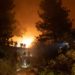 Firefighters saw trees on a hillside in order to open the path for bulldozers during the Mosquito Fire near Foresthill, California, US, on Wednesday, Sept. 7, 2022. A wildfire burning in the Tahoe National Forest exploded Wednesday afternoon prompting evacuation orders near Foresthill.
