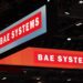 BAE Systems Plc logos on the opening day of the Defence and Security Equipment International (DSEI) 2021 exhibition in London, U.K., on Tuesday, Sept. 14, 2021. U.K. aerospace and defense firms have become a popular target for buyers, including private-equity firms. (Courtesy/Hollie Adams/Bloomberg)