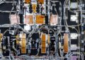 Circuit boards and cables sit of a satellite at the OHB SE clean rooms in Bremen, Germany. (Courtesy/Wolfram Schroll/Bloomberg)